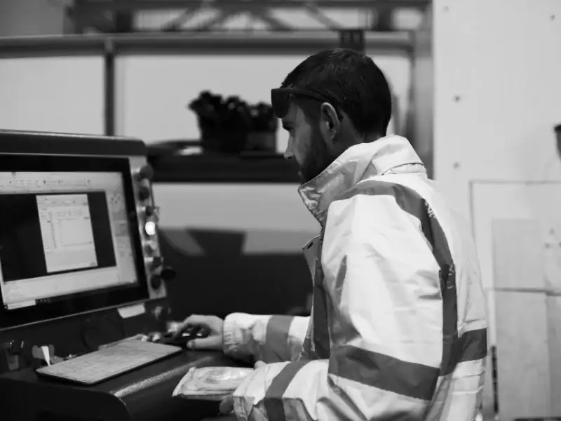 Operator using CypCut control at a Vector FL250 fibre laser cutting cell, Mantech UK